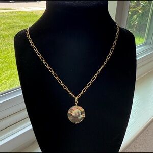 Handmade gold necklace with multicolor pendant.